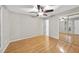Simple bedroom featuring a ceiling fan and a closet with mirrored doors at 3427 Mill Run, Raleigh, NC 27612