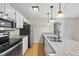 Modern kitchen with stainless steel appliances and granite countertops at 3427 Mill Run, Raleigh, NC 27612