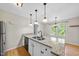 Granite countertops and a double sink create a functional space in the kitchen at 3427 Mill Run, Raleigh, NC 27612