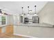 Open-concept kitchen with granite countertops and stainless steel appliances at 3427 Mill Run, Raleigh, NC 27612
