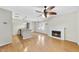 Spacious living room with hardwood floors, fireplace and a kitchen at 3427 Mill Run, Raleigh, NC 27612