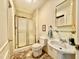 Bathroom with a shower/tub, toilet, and white pedestal sink at 405 Foster Ln, Burlington, NC 27215