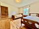Bedroom with two twin beds, wood floors, and a wooden door at 405 Foster Ln, Burlington, NC 27215