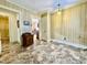 Hallway features tile flooring, with views of an adjoining bathroom and dining room, plus vintage wallpaper at 405 Foster Ln, Burlington, NC 27215