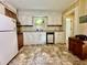 Bright kitchen with vintage cabinets and linoleum flooring at 405 Foster Ln, Burlington, NC 27215