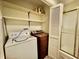 Laundry room with washer, dryer, shelves, and a shower stall at 405 Foster Ln, Burlington, NC 27215