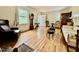Living room featuring hardwood floors, a grandfather clock, and a comfortable seating area at 405 Foster Ln, Burlington, NC 27215