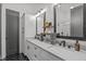 Bright bathroom featuring dual sinks, modern fixtures, and ample storage at 415 1St St, Apex, NC 27502