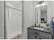 Modern bathroom featuring a walk-in shower, vanity, and sleek fixtures at 415 1St St, Apex, NC 27502