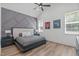 Bedroom features high ceilings, multiple windows, and a decorative accent wall at 415 1St St, Apex, NC 27502