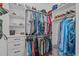 Organized walk-in closet with shelving, drawers, and ample space for clothes and shoes at 415 1St St, Apex, NC 27502
