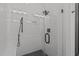 Modern shower with rainfall shower head, sleek glass door, bench, and white subway tile at 415 1St St, Apex, NC 27502