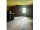 Interior of an attic space with wood flooring, paneled walls, and a window at 4796 Covered Bridge Rd, Archer Lodge, NC 27527