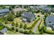 Aerial view of a home showcasing its well-maintained backyard with a screened porch and patio area at 604 Nottely Pl, Cary, NC 27519