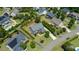 Aerial view of a beautiful home surrounded by mature trees and lush landscaping in a well-manicured neighborhood at 604 Nottely Pl, Cary, NC 27519