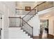 Foyer with an elegant staircase and beautiful details at 604 Nottely Pl, Cary, NC 27519
