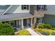 Front porch and entrance of a home featuring stone and siding, complete with meticulously landscaped surroundings at 604 Nottely Pl, Cary, NC 27519