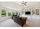 Spacious living room with built-in shelving, a large window, and comfortable furnishings at 604 Nottely Pl, Cary, NC 27519