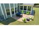 Back patio features sleek black table and fun chairs at 604 Nottely Pl, Cary, NC 27519