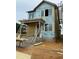 New two story construction showing exterior siding, brick foundation and scaffolding at 64 Rainfall Dr, Pittsboro, NC 27312
