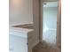 Hallway view showing the doorway that leads to a bonus room area at 64 Rainfall Dr, Pittsboro, NC 27312