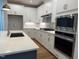 Modern kitchen with stainless steel microwave and oven at 64 Rainfall Dr, Pittsboro, NC 27312