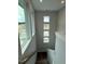 Bright stairwell features modern windows and natural light at 64 Rainfall Dr, Pittsboro, NC 27312