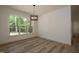 This light-filled dining area is ready for your personal touch at 690 Oaks Lane Rd, Timberlake, NC 27583
