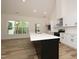 Modern kitchen features stainless appliances, an oversized island, and gorgeous white cabinets at 690 Oaks Lane Rd, Timberlake, NC 27583