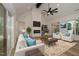Bright living room with high ceilings, modern fireplace, light wood floors, and inviting furniture at 690 Oaks Lane Rd, Timberlake, NC 27583