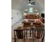 Cozy living room featuring high ceilings, a ceiling fan, comfortable seating and unique decor at 690 Oaks Lane Rd, Timberlake, NC 27583