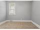 A bright and airy bedroom with a window offers a calm and inviting space for rest and relaxation at 7924 Knightdale Blvd, Knightdale, NC 27545
