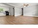 An open-concept living room and kitchen area with modern floors and updated appliances creates an inviting living space at 7924 Knightdale Blvd, Knightdale, NC 27545