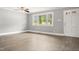 A spacious living room is brightened by natural light, and features light wood flooring at 7924 Knightdale Blvd, Knightdale, NC 27545