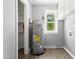 A functional utility room with ample natural light and storage ensures efficient home maintenance at 7924 Knightdale Blvd, Knightdale, NC 27545