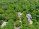 Wooded neighborhood aerial view with new home construction visible in a private, wooded, setting at 8011 Old Trail Dr, Durham, NC 27712