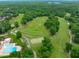 Aerial view of neighborhood amenities: pool, golf course and beautifully manicured green spaces at 8011 Old Trail Dr, Durham, NC 27712