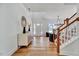 Inviting foyer with hardwood floors, modern decor, and a view of the living space at 8011 Old Trail Dr, Durham, NC 27712