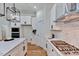 Contemporary kitchen featuring white cabinets, a center island, and stainless steel appliances at 8011 Old Trail Dr, Durham, NC 27712