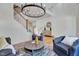 Cozy living area boasts hardwood floors, stylish seating, and a decorative chandelier at 8011 Old Trail Dr, Durham, NC 27712
