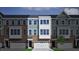 Charming new townhome with brick and siding, featuring a one-car garage and inviting curb appeal at 944 Westerland Way # 140, Durham, NC 27703