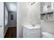 Updated bathroom with vanity, decorative mirror, and storage cabinet for added convenience at 100 Honeysuckle Ln, Cary, NC 27513