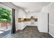 Kitchen with white appliances, light countertops and slider to deck at 100 Honeysuckle Ln, Cary, NC 27513