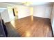 A living room with hardwood floors, a fireplace, and neutral walls showcases an open floor plan at 100 Honeysuckle Ln, Cary, NC 27513