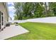 A view of the backyard featuring a white fence and an outdoor patio with a barbecue grill at 100 Pronghorn Deer Ct, Garner, NC 27529