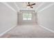 Bright, neutral bedroom with trey ceiling, carpeted floors, and a ceiling fan at 100 Pronghorn Deer Ct, Garner, NC 27529