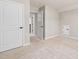Neutrally painted bedroom with closet doors and carpet at 100 Pronghorn Deer Ct, Garner, NC 27529