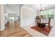 Elegant dining area with wainscoting and a view into the living space, perfect for entertaining at 100 Pronghorn Deer Ct, Garner, NC 27529