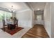 Well-lit dining room with a view of the entry and features elegant wainscoting at 100 Pronghorn Deer Ct, Garner, NC 27529