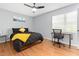 Cozy bedroom with hardwood floors, a ceiling fan, and dedicated workspace at 1002 Willow Dr # Apt 107, Chapel Hill, NC 27514